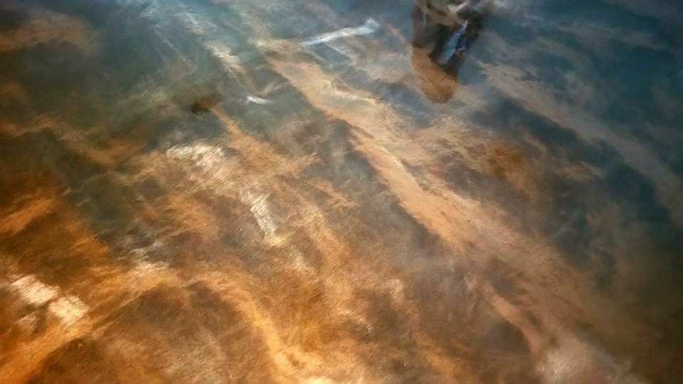 Dark metallic epoxy floor with marble-like movement